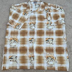 Shirt with a bunch of heads on it